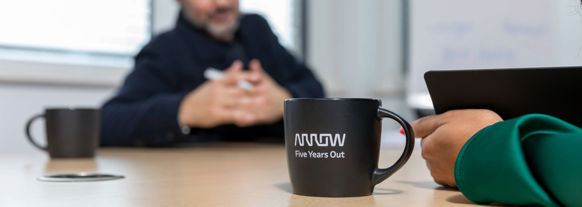 Coffee mug with "Arrow Five Years Out" on the front.