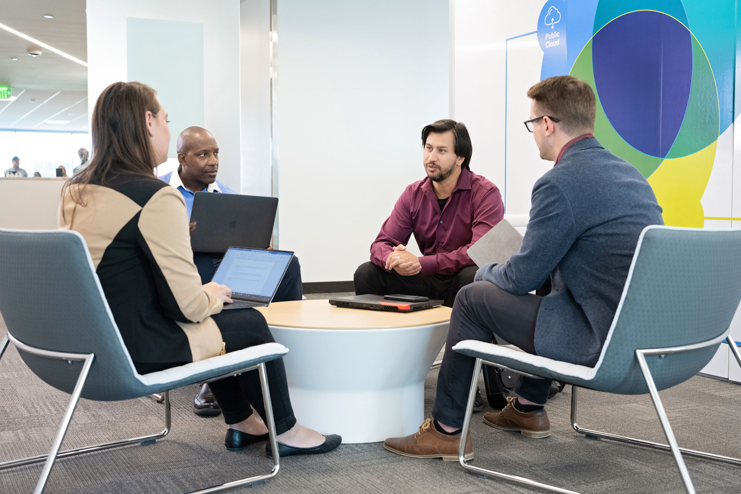 Four_Colleagues_Sitting_In_Meeting_Area