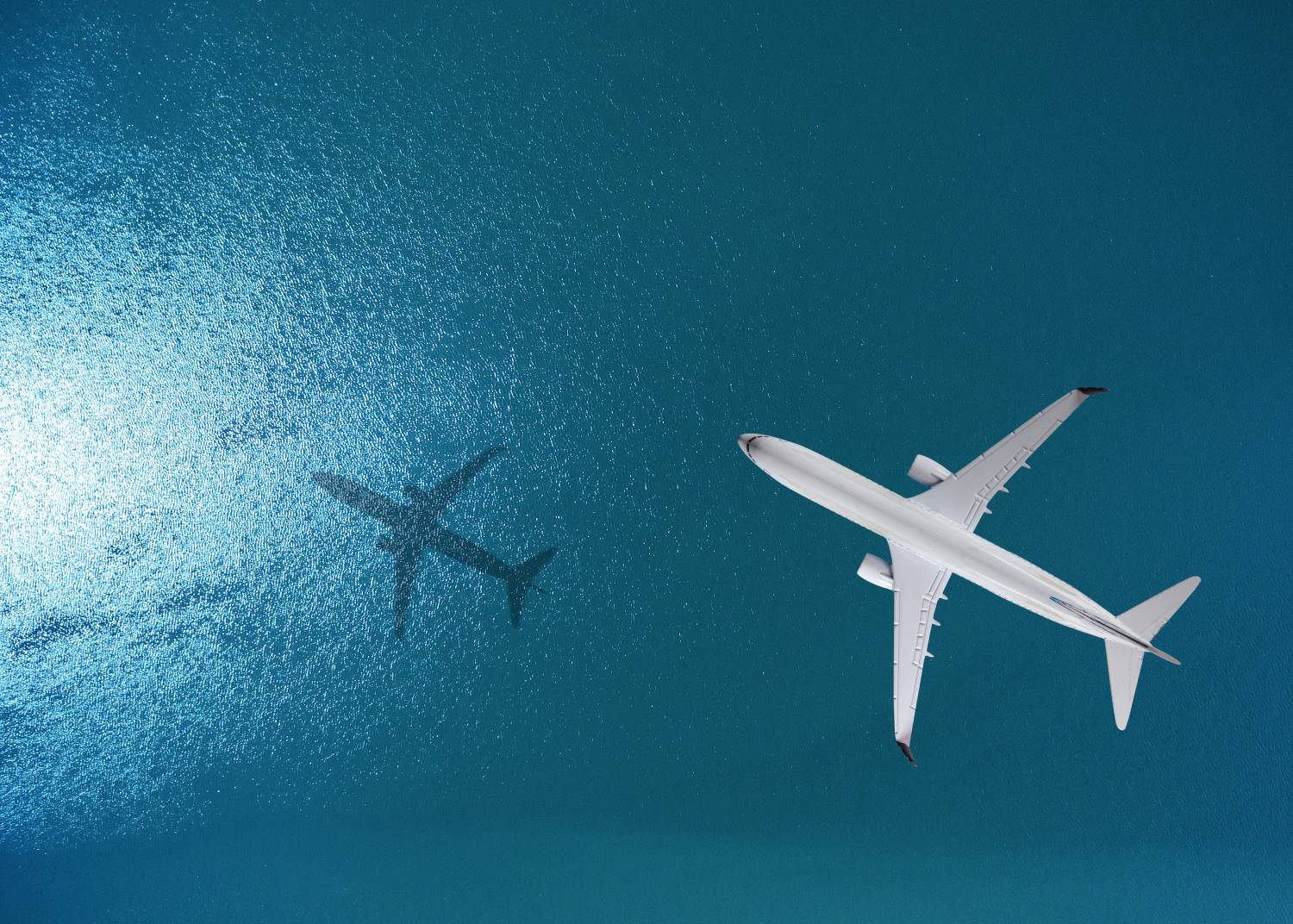 Airplane_Over_Sea_Aerial Airplane Flies Over The Sea
