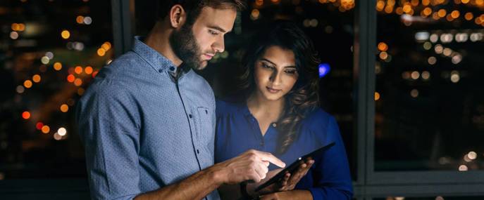 Male_and_Female_Around_Tablet_Night