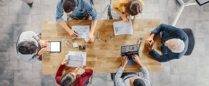 Employees_Collaborating_at_Roundtable_Aerial