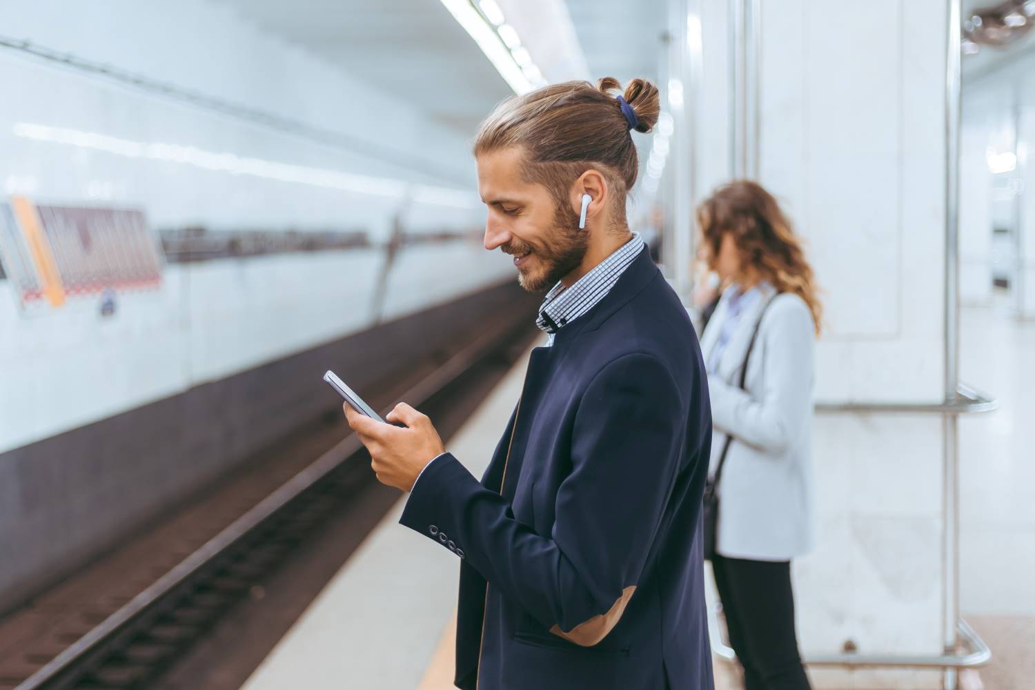 Subway Passengers Wait For The Train To Arrive