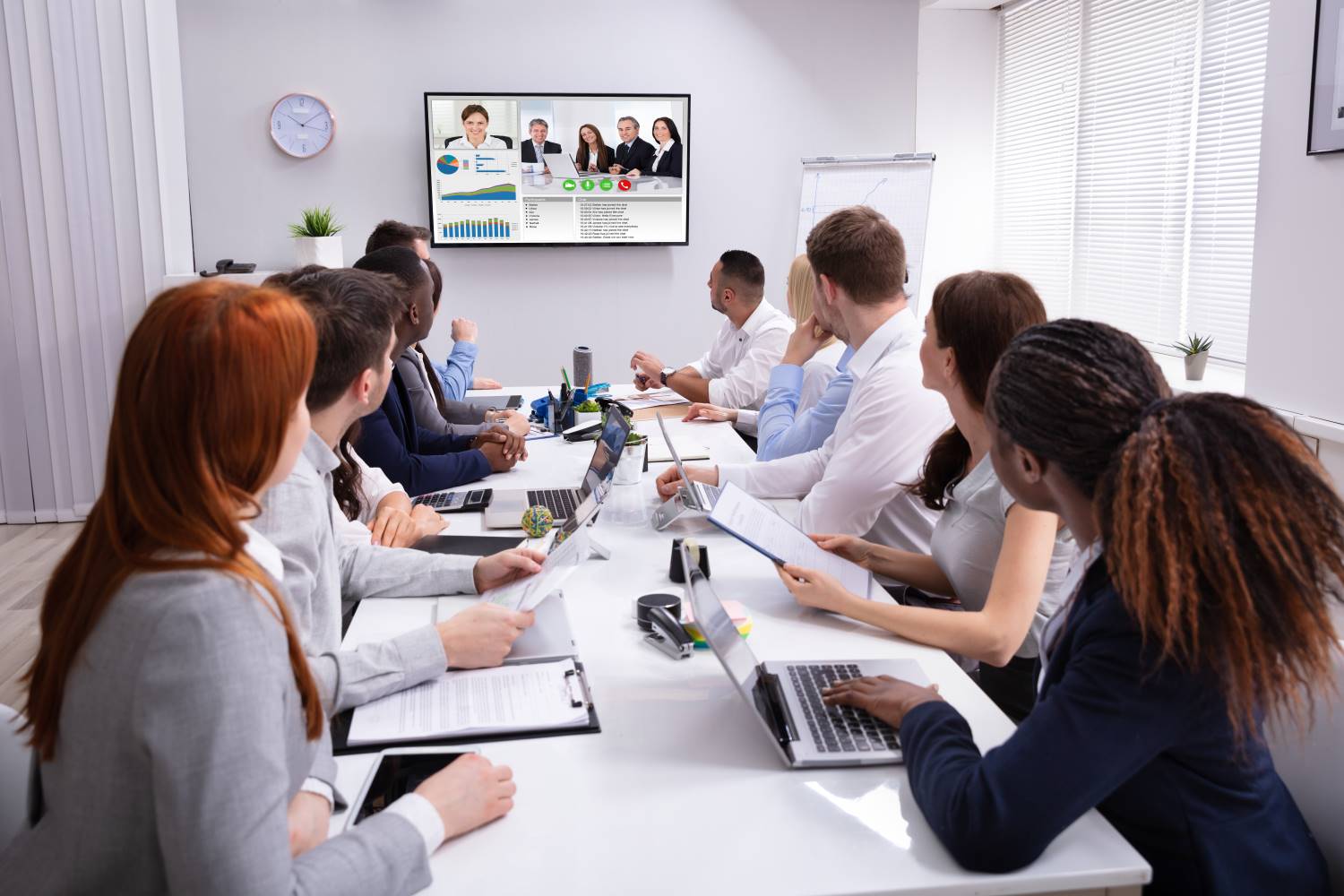 Mixed_Gender_Video_Conference Group Of Business People Having A Video Conference