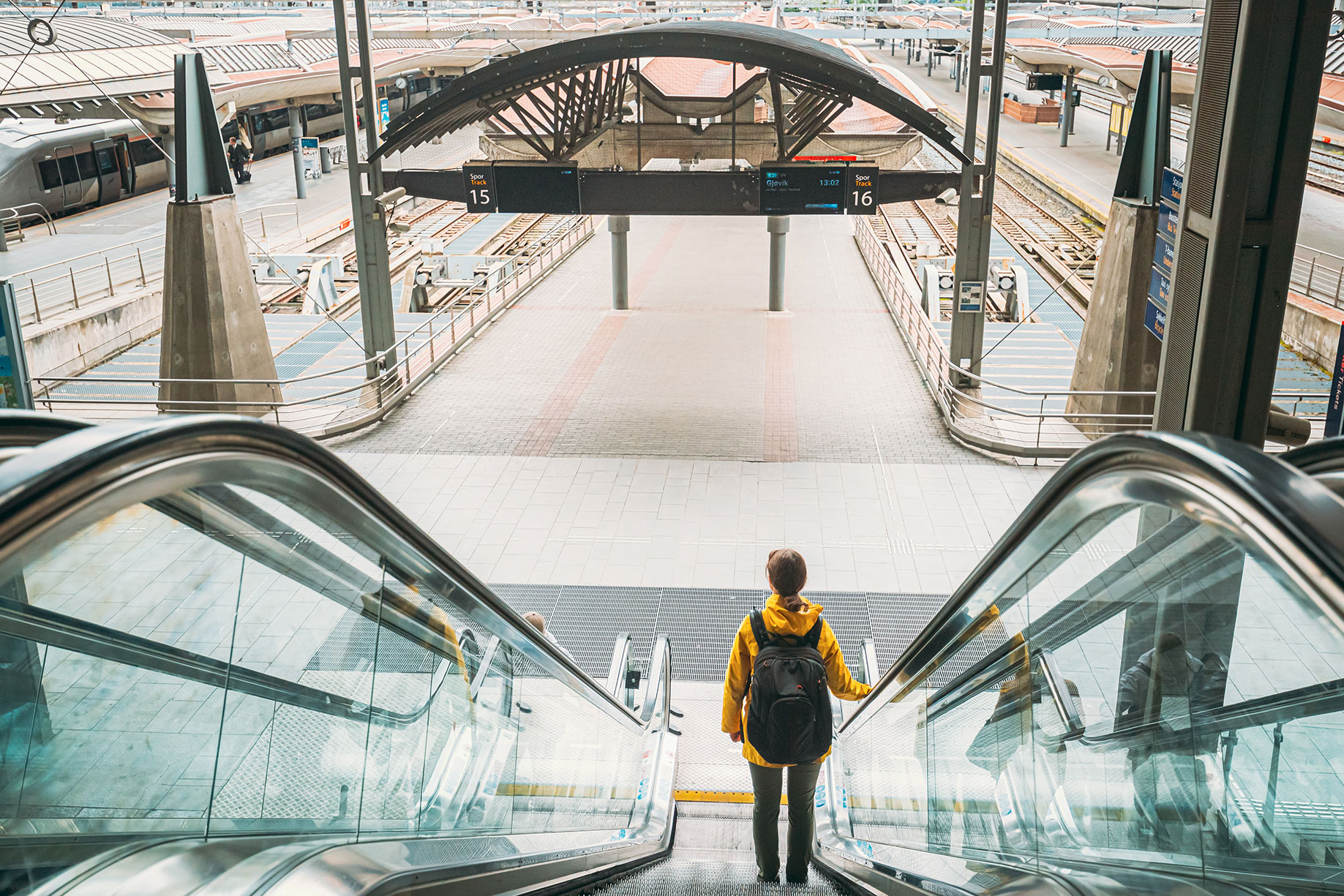 Woman_Riding_Escalator_Oslo_Railway_Station